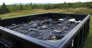 roof shingles in dumpster